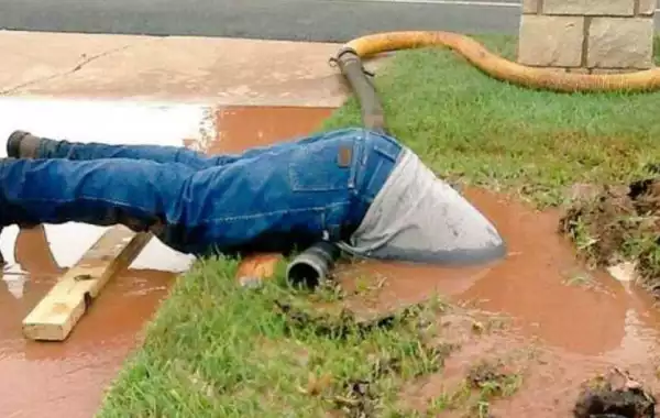 Passion? Photo of waist deep in muddy water fixing pipe goes viral